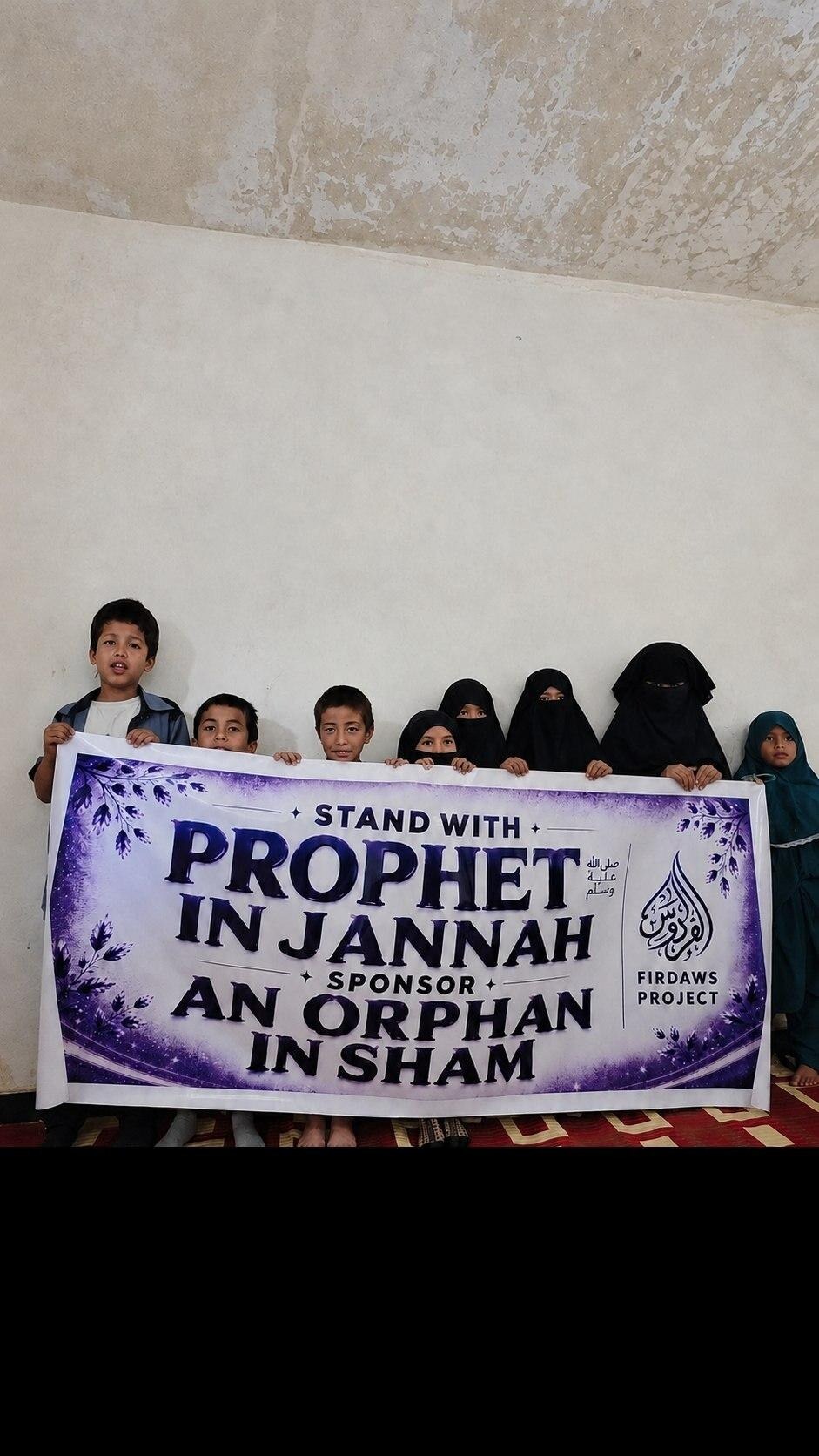 Children and widowed mothers with a Firdaws Project banner in Sham