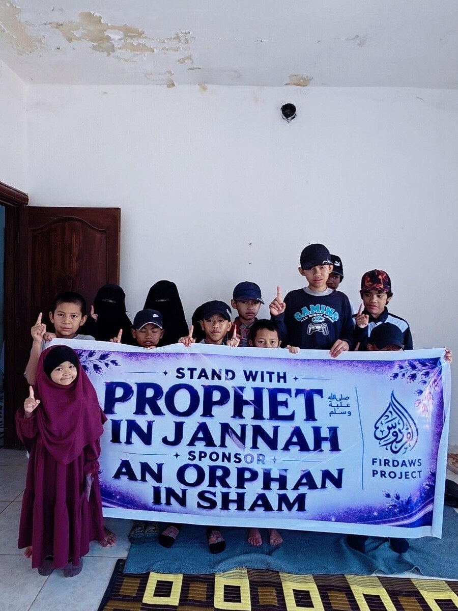 A sister in niqab with a child receiving support